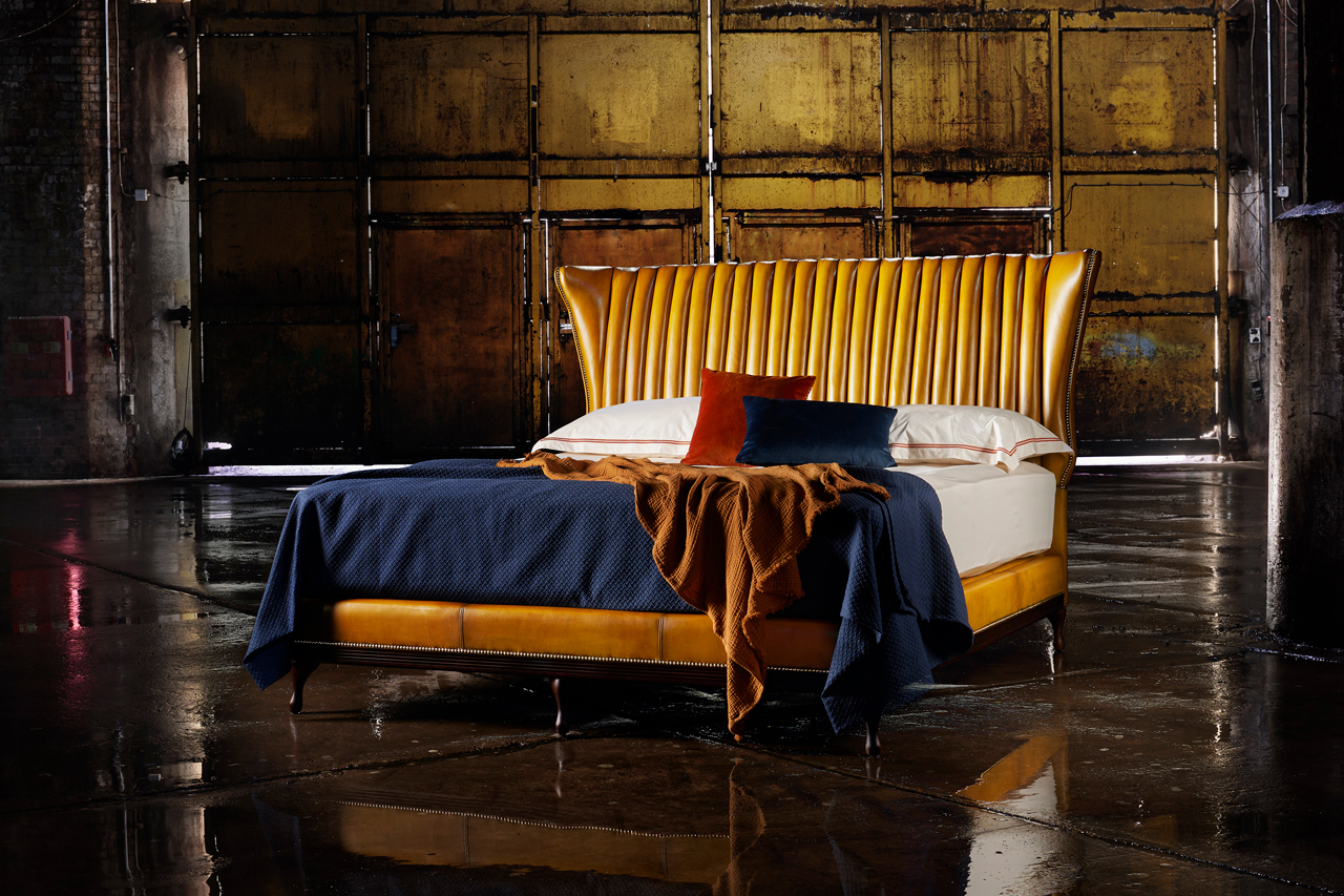 Oliver Goldsmith genuine leather fluted bed featuring distinguished barrel design with graceful fluting