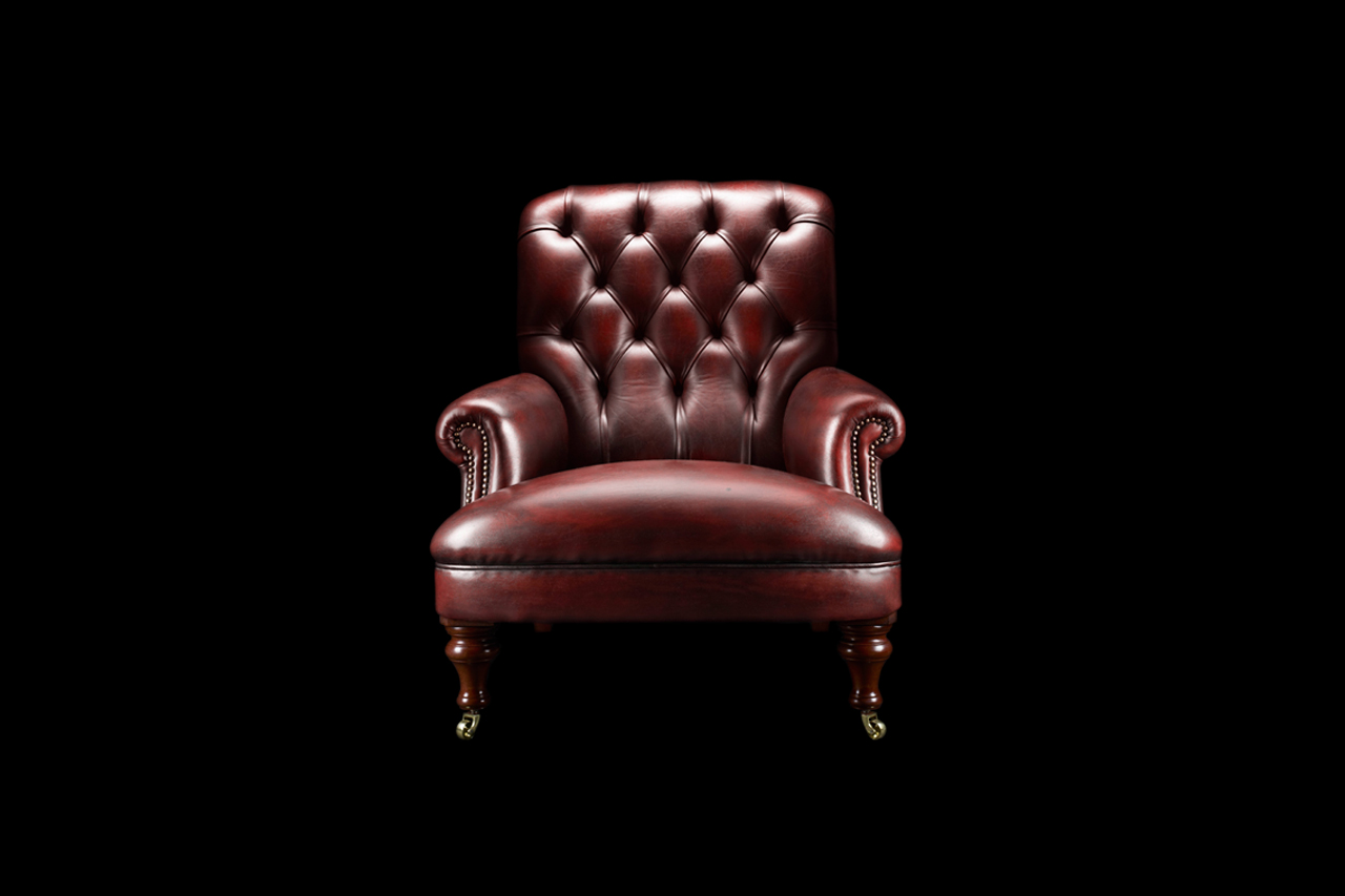 Havelock Ellis chesterfield reading chair with sleek contours and padded armrests