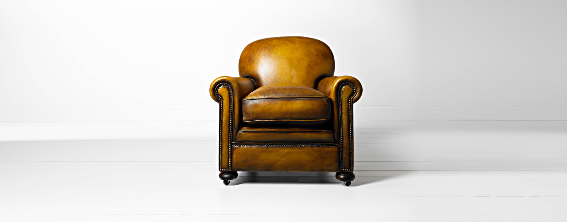 Deco leather chair with elegant form influenced by Georgian design