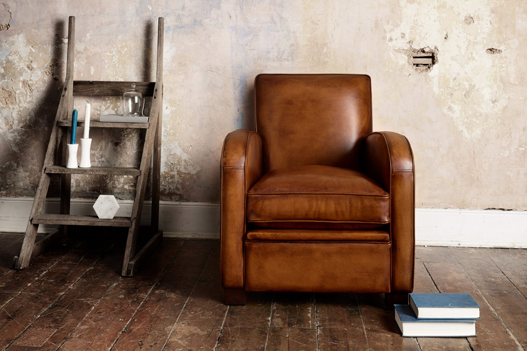 Sloop art deco leather chair with smooth flowing contours and harmonious form