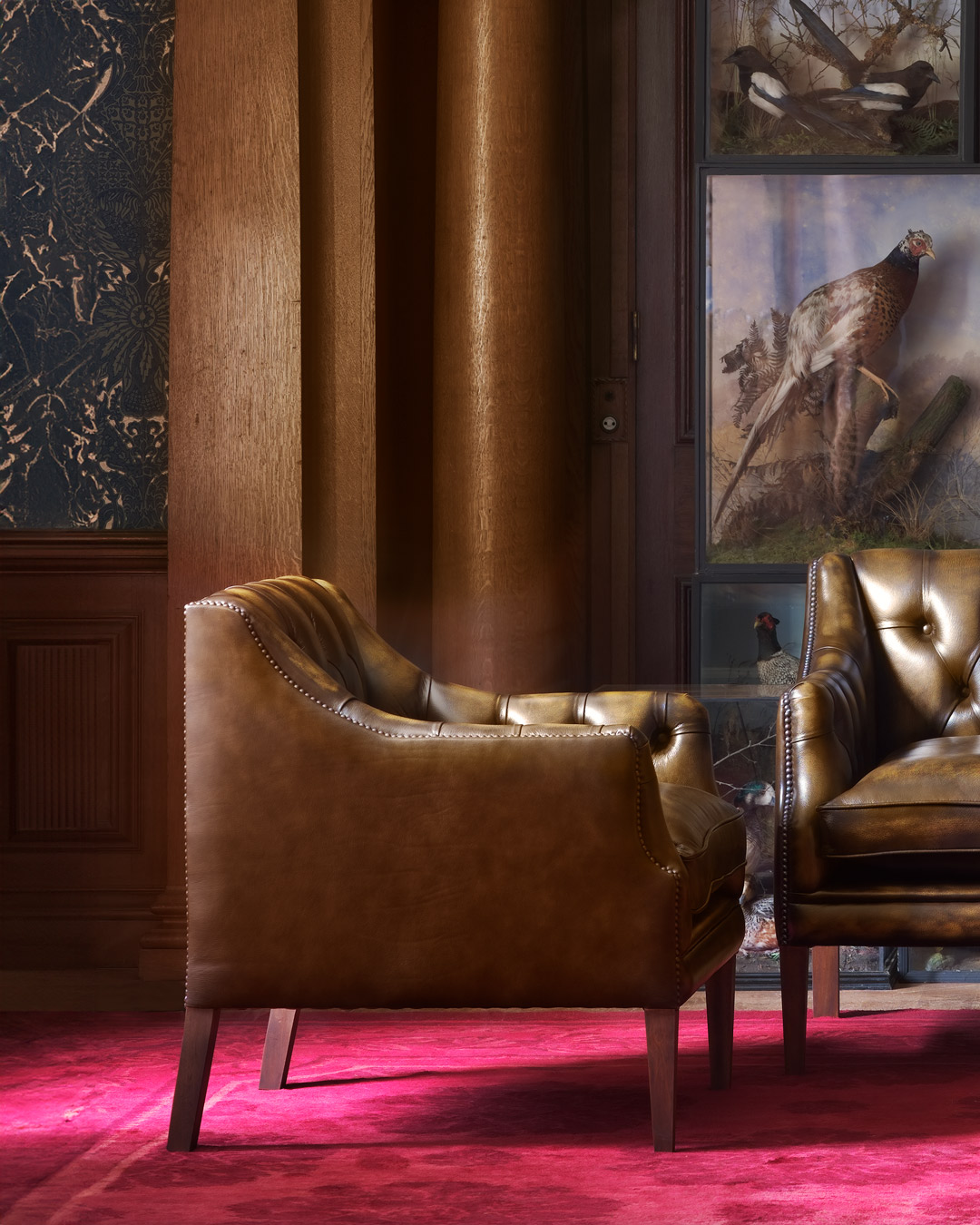 Benjamin luxury chesterfield chair with slender scallop shaped arms and graceful detailing