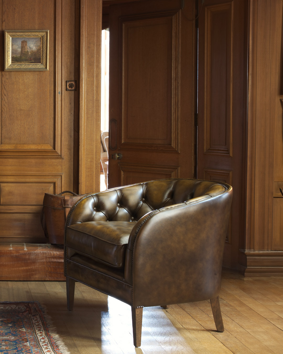 Tobias chesterfield chair with gently curving silhouette and rounded form