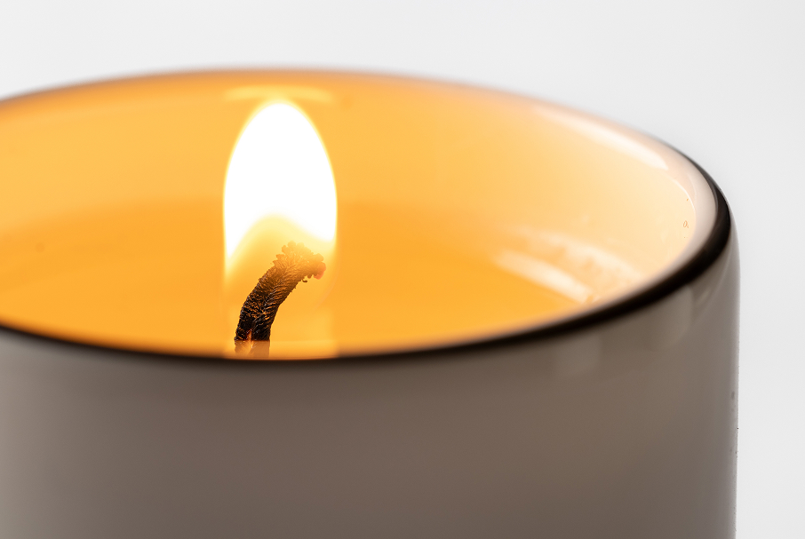 Single candle illuminating